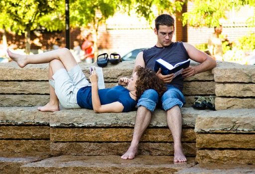 Couple reading in park